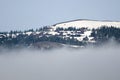 Snowy Mountain Peaks Standing Above the Clouds Royalty Free Stock Photo