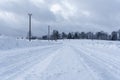 Snowy white road where along the edge runs Royalty Free Stock Photo