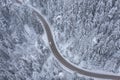 Snowy Winding Curving Mountain Road with Moving Car During Snowfall