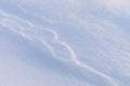 Snowy winter background. Ground covered in white snow. Natural pattern of snow in winter. Royalty Free Stock Photo