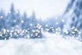 Snowy winter christmas bokeh background with lights and trees Royalty Free Stock Photo