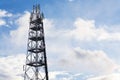 Snowy winter country with transmitters and aerials on telecommunication tower Royalty Free Stock Photo