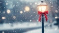 Snowy winter evening with a decorative lamppost adorned with a red bow in a quiet park