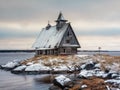 Snowy winter landscape with authentic cinematic house on the shore in the Russian village Rabocheostrovsk