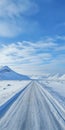 Breathtaking Norwegian Nature: Snowy Road, Sky, And Mountains