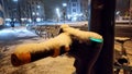 Snowy winter night with escooter or emobility bike sharing concepts in snowy city streets