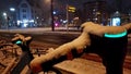 Snowy winter night with escooter or emobility bike sharing concepts in snowy city streets