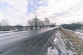 snowy winter road covered in deep snow - vintage retro look Royalty Free Stock Photo
