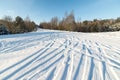 Snowy winter road with tire markings Royalty Free Stock Photo