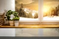 Kitchen table top with space for products and decorations.  Snowy winter sunshine mountains landscape outside the window. Royalty Free Stock Photo