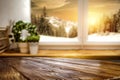 Kitchen table top with space for products and decorations.  Snowy winter sunshine mountains landscape outside the window. Royalty Free Stock Photo