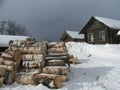 Snowy winter in the village. Wooden house.