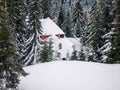 Snowy Wooden Cottage At Muntele Mic Resort Royalty Free Stock Photo