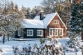 Snowy wooden house in the forest Royalty Free Stock Photo