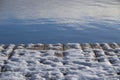 Snowy wooden textured boards of a jetty Royalty Free Stock Photo