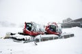 Snowploughs machinery plowing snow on ground in Tyrol, Austria