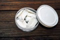 Snus box with nicotine pouches on wooden background. Royalty Free Stock Photo