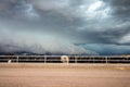 SNYDER, COLORADO - MAY 27, 2019: Cattle stand with their backs turned to a tornado-warned thunderstorm.