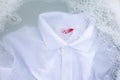 Soak a cloth before washing, white polo shirt. Royalty Free Stock Photo