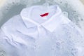 Soak a cloth before washing, white polo shirt Royalty Free Stock Photo