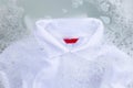 Soak a cloth before washing, white polo shirt Royalty Free Stock Photo