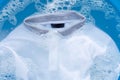 Soak a cloth before washing, white polo shirt. Royalty Free Stock Photo
