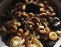 Soak dried Shiitake mushrooms in water Royalty Free Stock Photo