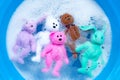 Soak rabbit dolls with toy teddy bear in laundry detergent water dissolution before washing. Laundry concept