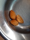 Soaked Almonds.Almond soaked in steel pot. Royalty Free Stock Photo