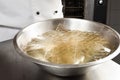 Soaking the gelatine leaves in a bowl of water