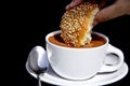 Soaking sweet bread in a cup of mexican hot chocolate Royalty Free Stock Photo