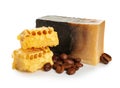 Soap bar with coffee beans and honeycombs on white background Royalty Free Stock Photo