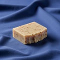 Soap bar with visible textures and embedded particles rests on a smooth, Royalty Free Stock Photo