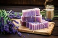 soap bar on a wooden table, lavender sprigs around it Royalty Free Stock Photo