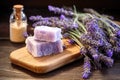 soap bar on a wooden table, lavender sprigs around it Royalty Free Stock Photo