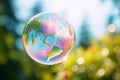 Soap bubble Earth floating in the air. Earth Day, save the planet concept. Ecology and sustainability, fragile world, saving the Royalty Free Stock Photo