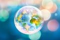 Soap bubble Earth floating in the air. Earth Day, save the planet concept. Ecology and sustainability, fragile world, saving the Royalty Free Stock Photo