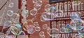 Soap bubbles with deliberately blurred half-timbered buildings in the background