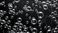 Soap bubbles floating on dark background creating abstract pattern Royalty Free Stock Photo