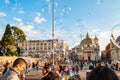 Soap bubbles flying on Piazza del Popolo, People Square in Rome full of happy positive people, tourists and locals with Roman Royalty Free Stock Photo