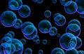 Soap bubbles isolated on black background. Rainbow soap bubble. Bright green and orande colors. Royalty Free Stock Photo