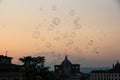 Soap bubbles soar in the air. Beautiful evening sunset in Florence. Soap bubbles evening sky. Florence, Italy Royalty Free Stock Photo