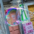 Soap Bubbles in a Street near Colofrul Doors Royalty Free Stock Photo