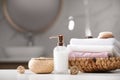 Soap dispenser, towels and brush on white table Royalty Free Stock Photo