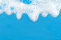 Soap foam. Background of dusty foam with bubbles of blue color for an inscription. Soap sud with copy-space Royalty Free Stock Photo