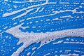 Soap foam on a blue background Royalty Free Stock Photo