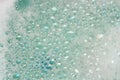 Soap foam on blue water Royalty Free Stock Photo