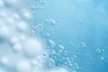 Soap foam, blue water surface texture with bubbles and splashes. Clear water abstract nature background, copy space for text Royalty Free Stock Photo