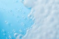 Soap foam, blue water surface texture with bubbles and splashes. Clear water abstract nature background, copy space for text Royalty Free Stock Photo