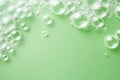 Soap foam, green water surface eco texture with bubbles and splashes. Clear water abstract nature background, copy space for text Royalty Free Stock Photo